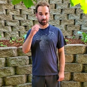 Slightly distressed Marvel brand Venom Legs tee